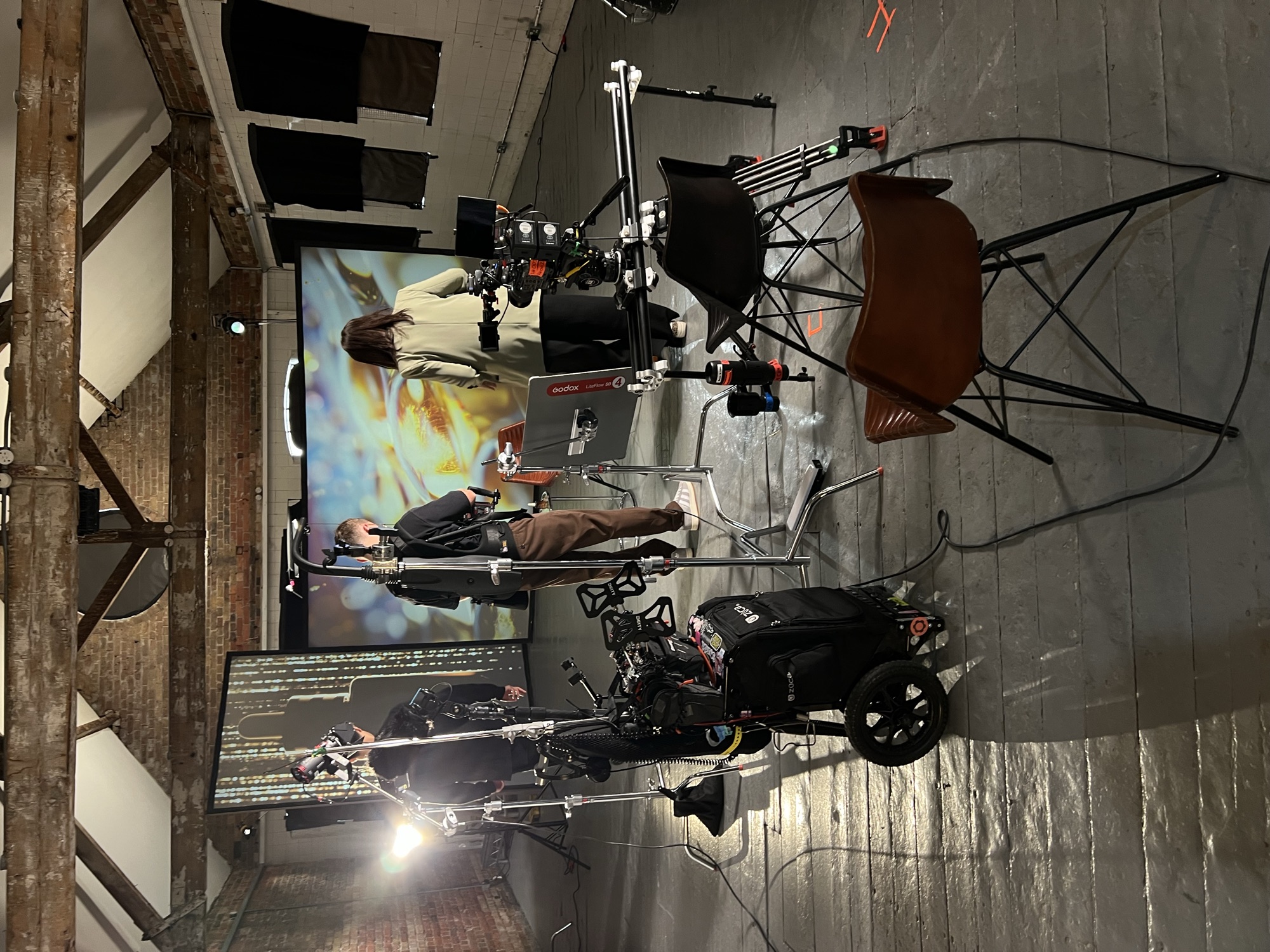 The set from above: crane arm, lighting rig and projection screen