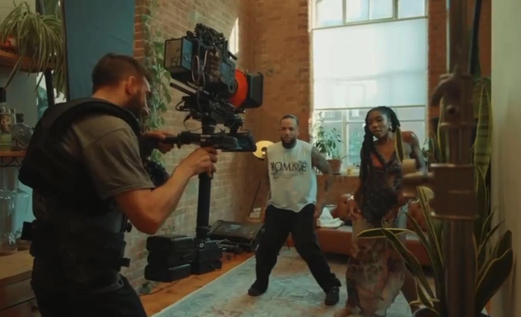 Steadicam operator following the dancers across the loft