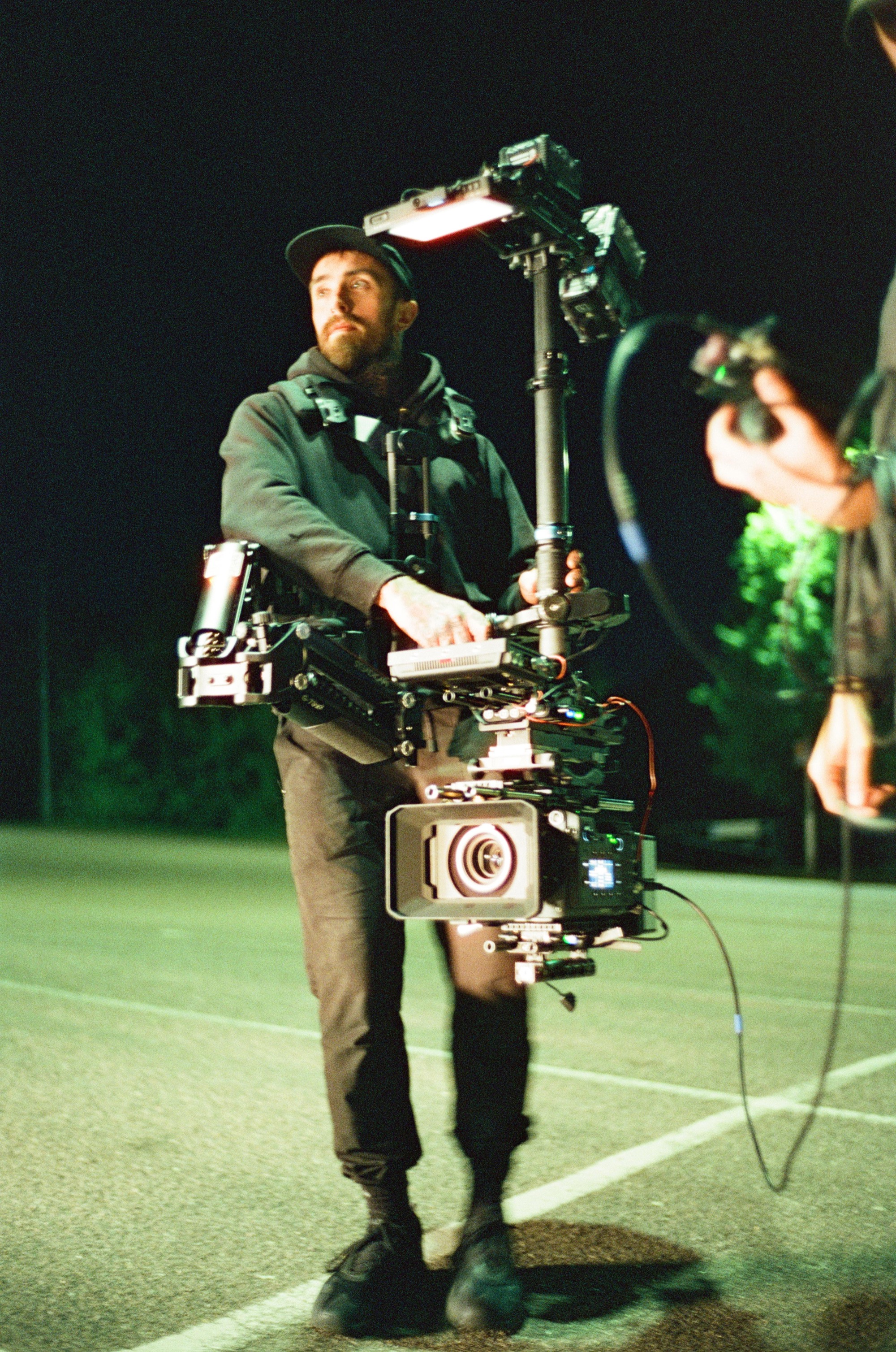 Steadicam operator with the rig at night