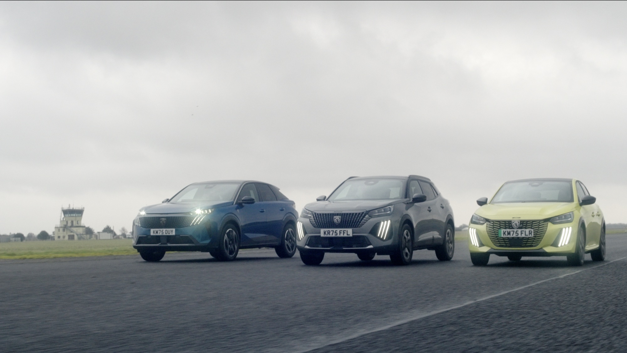 Three Peugeots lined up on a runway under a grey sky, from the Peugeot commercial