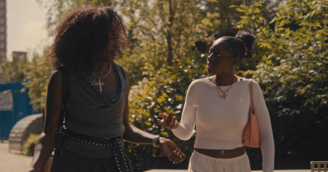 Two women talking in a park